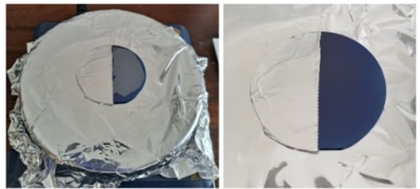Changing the surface properties of the backside of a silicon wafer to repel oil and prevent particle binding
